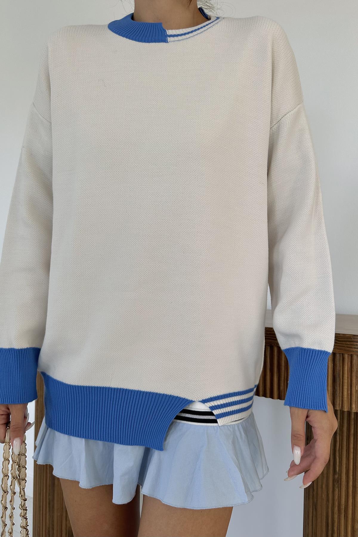 بلوزة صوف بيضاء بتفاصيل جميلة باللون الازرق