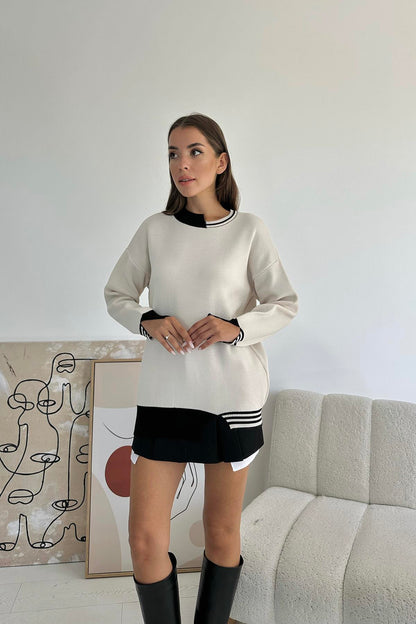 بلوزة صوف بيضاء بتفاصيل جميلة باللون الاسود